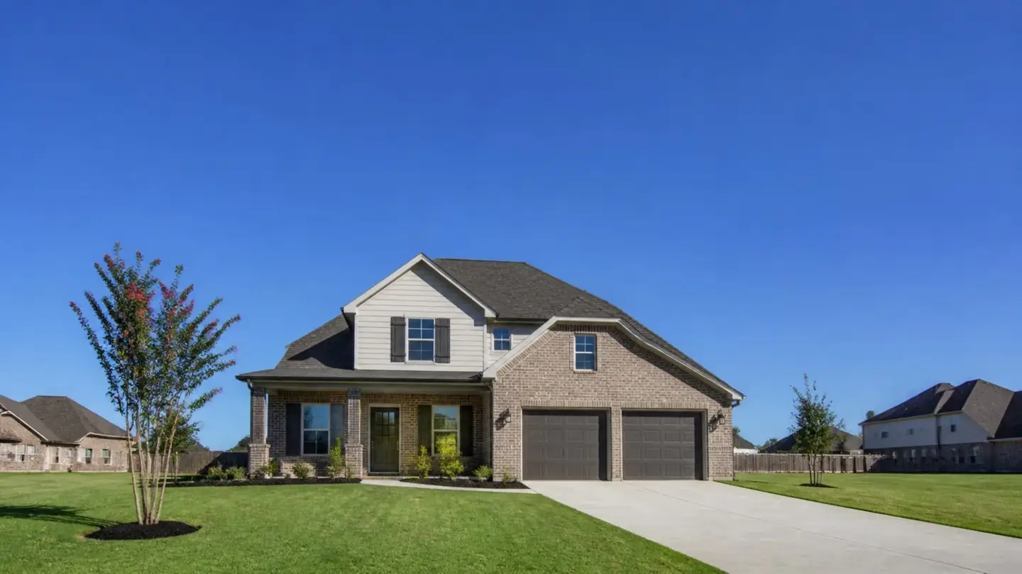 Newer two-story brick home with a two-car garage, typical of Prairieville's growing subdivisions